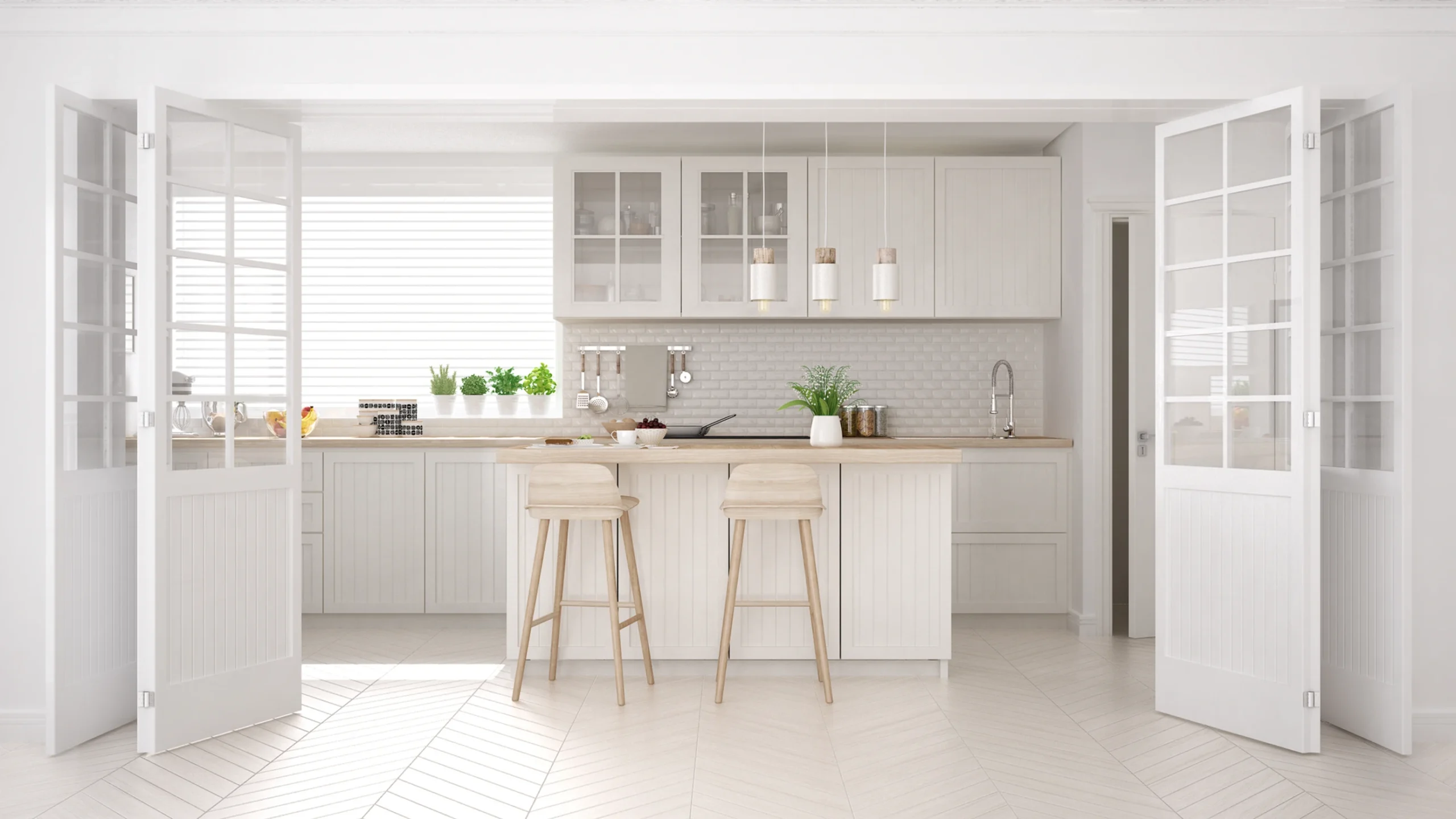 Modern white kitchen with calming neutrals, island, wood stools, pendant lights, potted plants & glass cabinets.