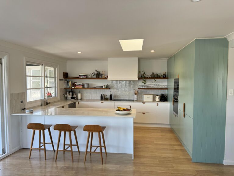 Modern kitchen with white cabinets island stools light wood floor Collaroy Plateau Door & Benchtop Reface.