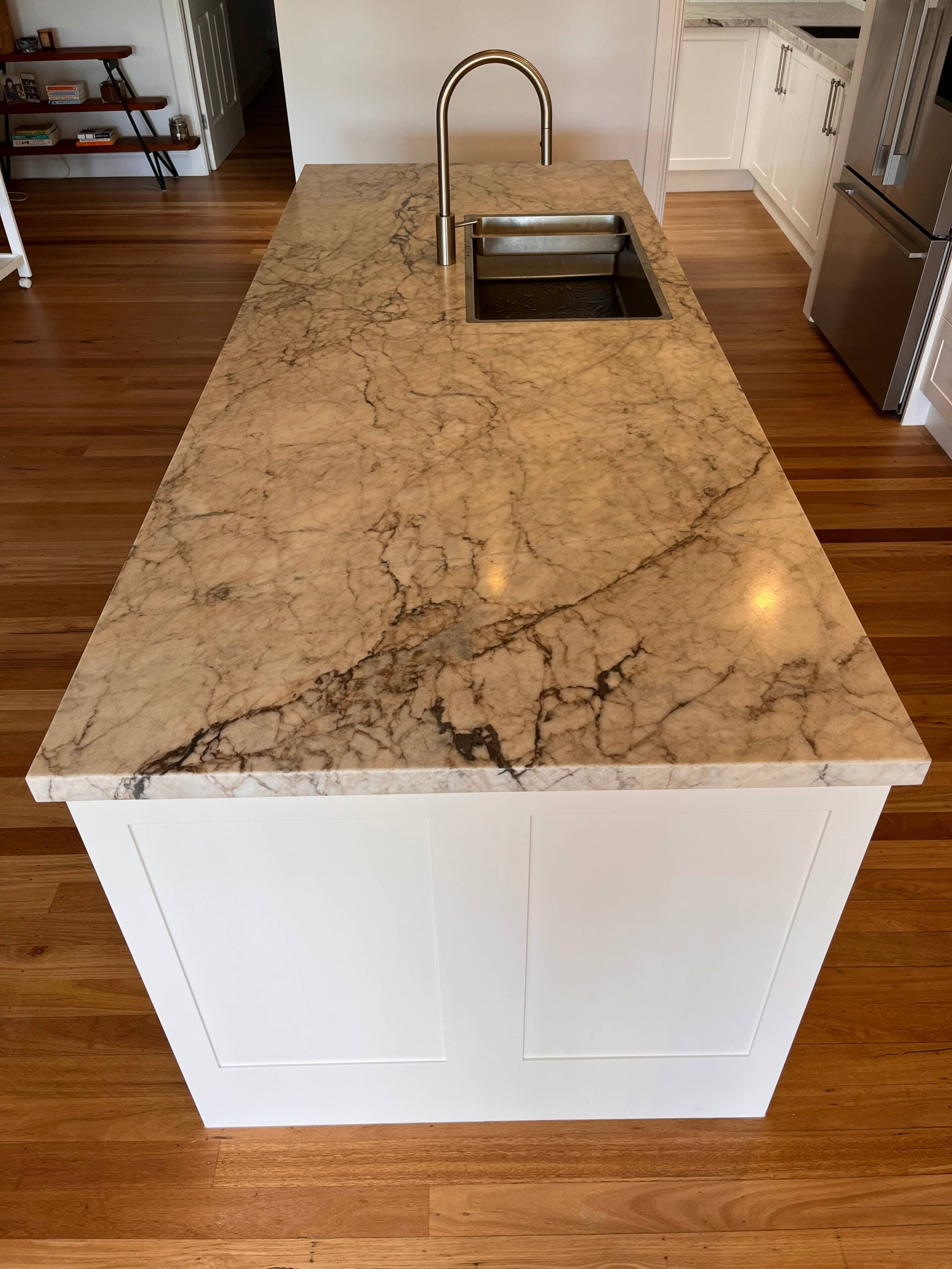 Marble kitchen island with sink and modern faucet, ideal for Kitchen Renovation by Red Hot Kitchens Collaroy Plateau.